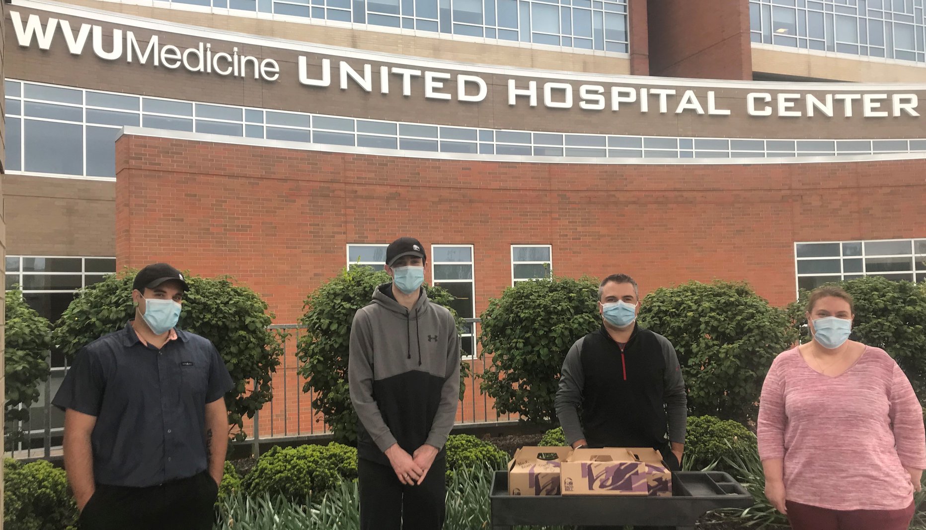 Donors outside United Hospital Center with masks on